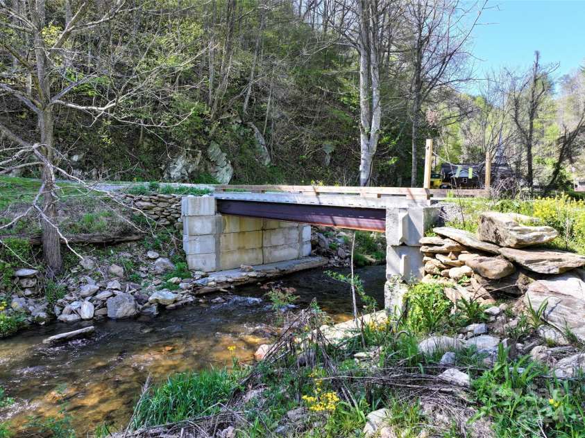 2180 Pigeon Roost Road, Green Mountain, NC 28740.  MLS# CAR4137054, YatesRealty ID 1587. New heavy duty bridge leading to hidden meadow, ready for your builders to use!