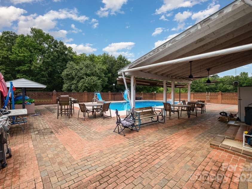 907 Sikes Mill Road, Monroe, NC 28110.  MLS# CAR4256950, YatesRealty ID 15874. 