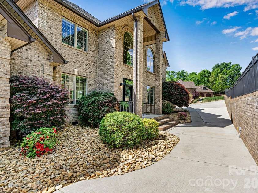 4202 54th Avenue, Hickory, NC 28601.  MLS# CAR4365981, YatesRealty ID 15875. Focused Front Walk with Cart Path to Lake)