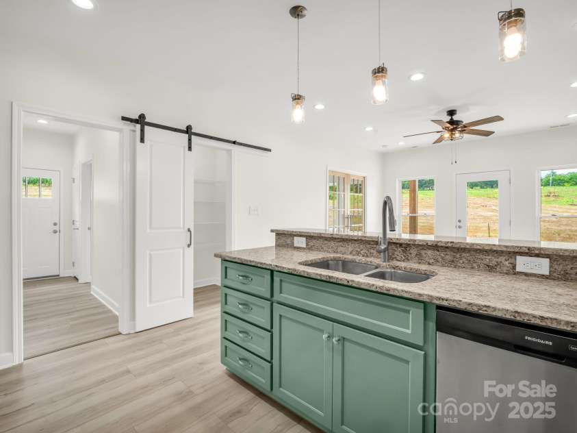 174 Charlie Randall Road, Lawndale, NC 28090.  MLS# CAR4276415, YatesRealty ID 15876. Custom barn doors into spacious pantry