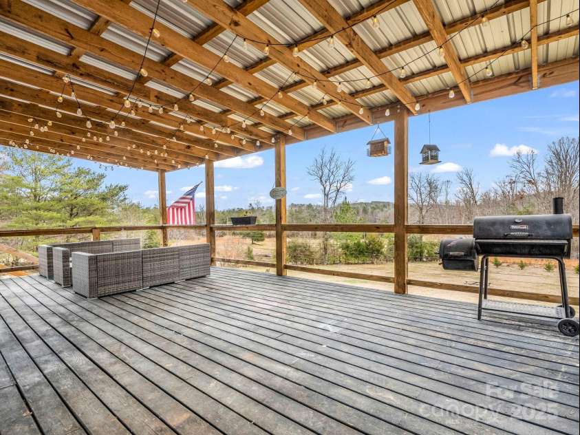 135 Dakota Hill Lane, Mill Spring, NC 28756.  MLS# CAR4229222, YatesRealty ID 15880. Covered Back Deck