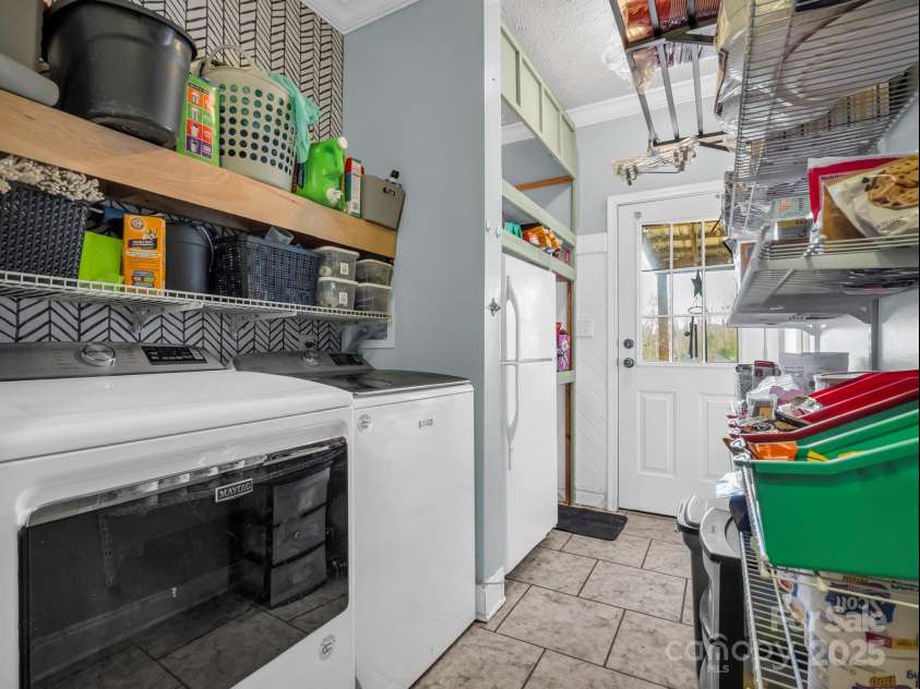 135 Dakota Hill Lane, Mill Spring, NC 28756.  MLS# CAR4229222, YatesRealty ID 15880. Laundry