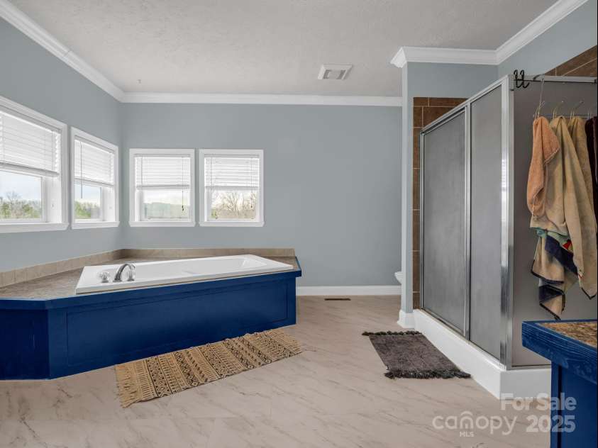 135 Dakota Hill Lane, Mill Spring, NC 28756.  MLS# CAR4229222, YatesRealty ID 15880. Primary Bath