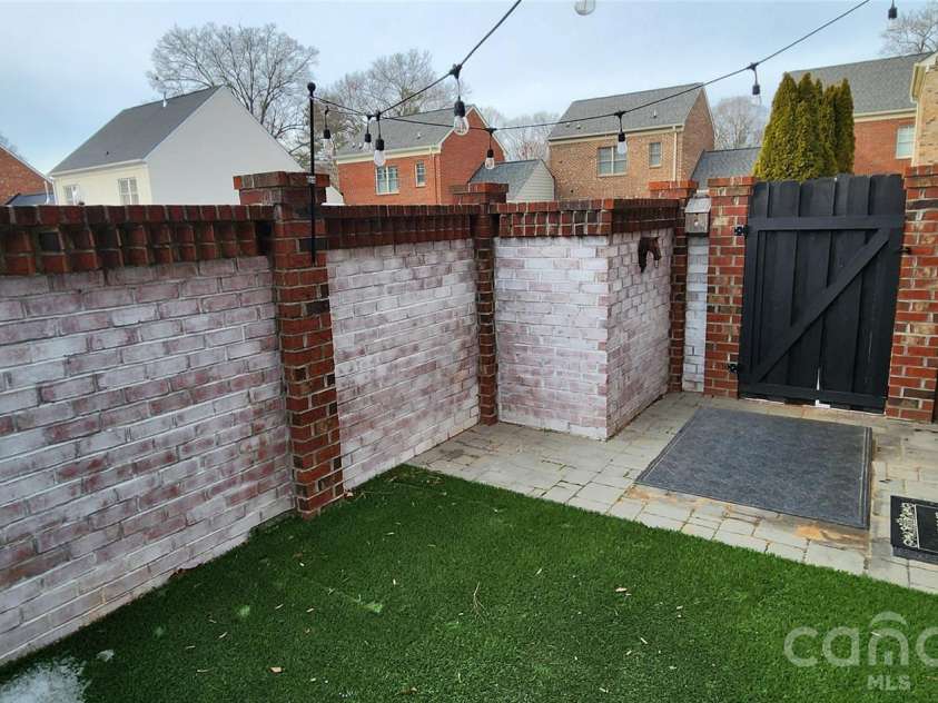 308 Rosemont Row, Belmont, NC 28012.  MLS# CAR4343510, YatesRealty ID 15883. Private Patio / Courtyard with Entry Gate in back.