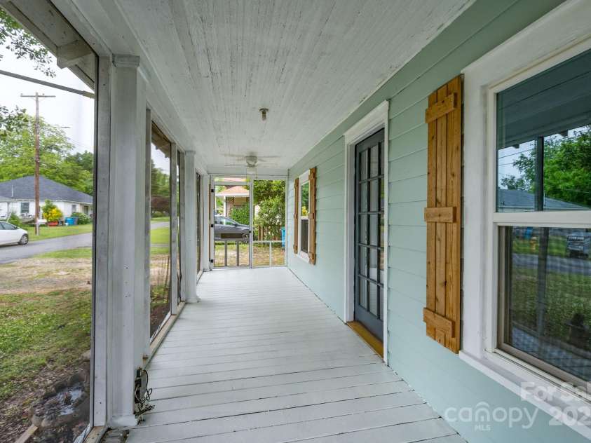 917 Laye Street, Belmont, NC 28012.  MLS# CAR4254861, YatesRealty ID 15892. Another view of the porch with new shutters and newly painted siding