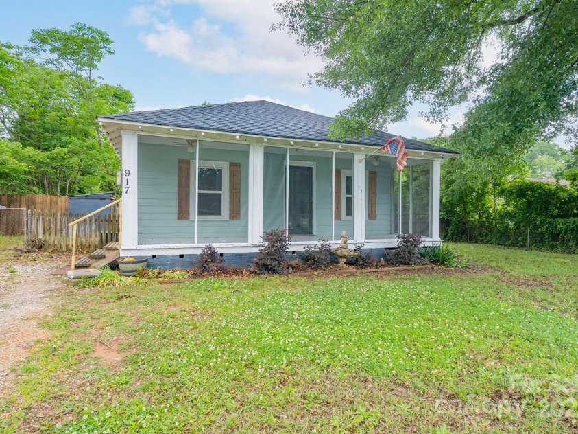 917 Laye Street, Belmont, NC 28012.  MLS# CAR4254861, YatesRealty ID 15892. Full rocking chair front porch fully screened.