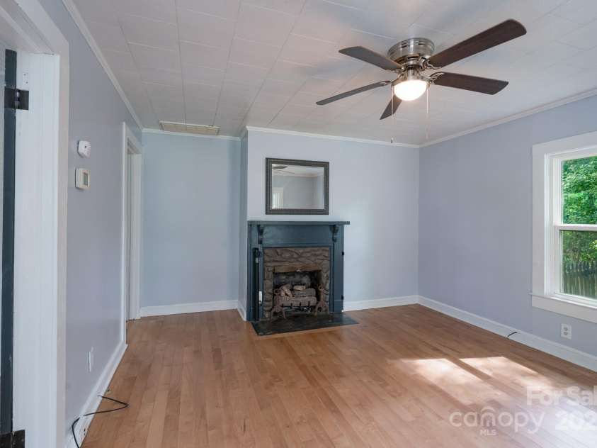 917 Laye Street, Belmont, NC 28012.  MLS# CAR4254861, YatesRealty ID 15892. Living room with fireplace and gas logs