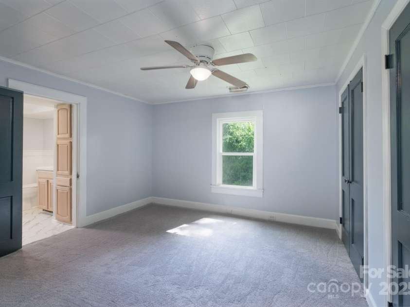 917 Laye Street, Belmont, NC 28012.  MLS# CAR4254861, YatesRealty ID 15892. Primary bedroom, ceiling fan, newly painted and brand new carpet
