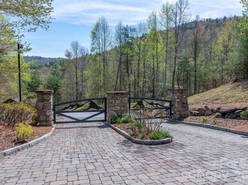 716 Peppervine Circle, Brevard, NC 28712.  MLS# CAR4374507, YatesRealty ID 15899. Community Entryway Gates