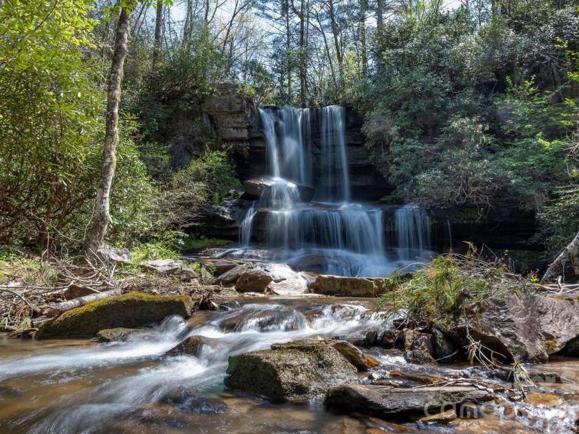716 Peppervine Circle, Brevard, NC 28712.  MLS# CAR4374507, YatesRealty ID 15899. Community Waterfall