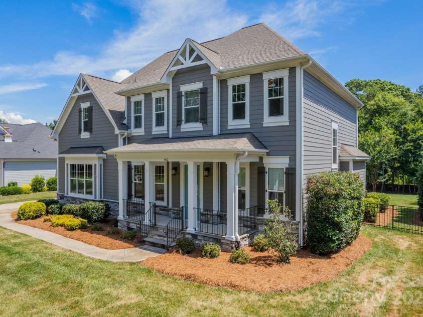 142 Tuscany Trail, Mooresville, NC 28117.  MLS# CAR4230822, YatesRealty ID 1590. Your Rocking Chair Front Porch Dreams!