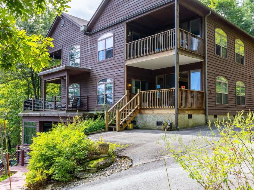 30 Lower Tanglewood Road, Lake Toxaway, NC 28747.  MLS# CAR4176732, YatesRealty ID 15904. Parking space at the back deck