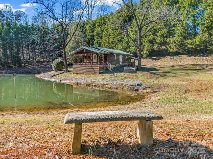 620 Smith Waldrop Road, Columbus, NC 28722.  MLS# CAR4209729, YatesRealty ID 15909. Beautiful, private pond in front of Guest Cabin