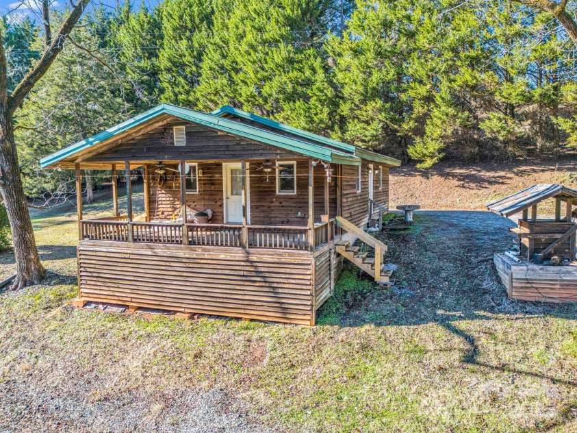 620 Smith Waldrop Road, Columbus, NC 28722.  MLS# CAR4209729, YatesRealty ID 15909. Cabin with great privacy behind main house.