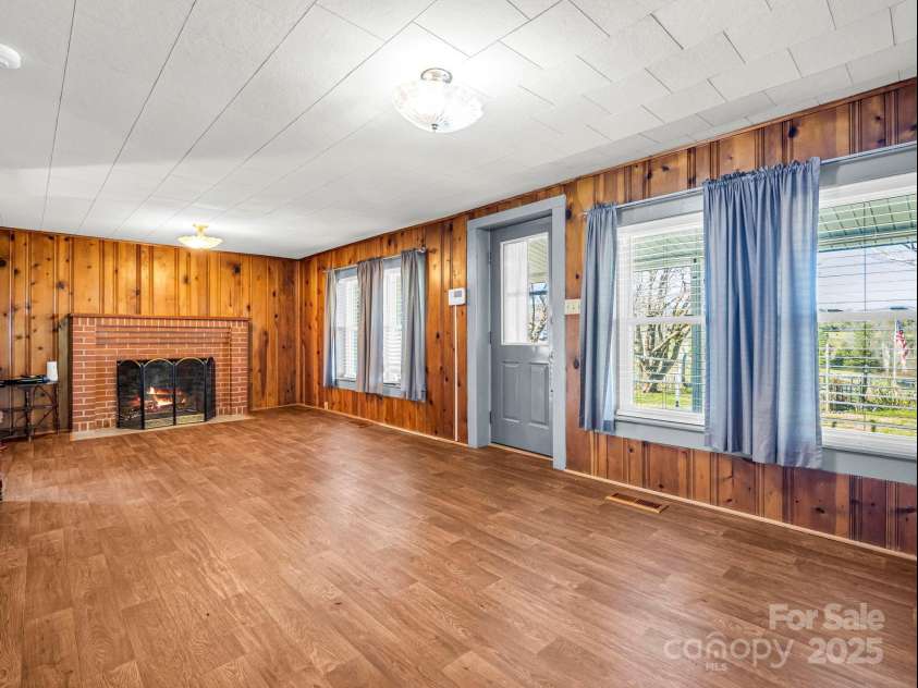 620 Smith Waldrop Road, Columbus, NC 28722.  MLS# CAR4209729, YatesRealty ID 15909. Living Room at main house, with propane 