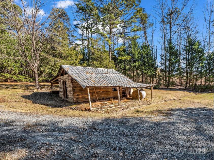 620 Smith Waldrop Road, Columbus, NC 28722.  MLS# CAR4209729, YatesRealty ID 15909. Old barn down near cabin & pond, in bad condition, but would make a good building site!