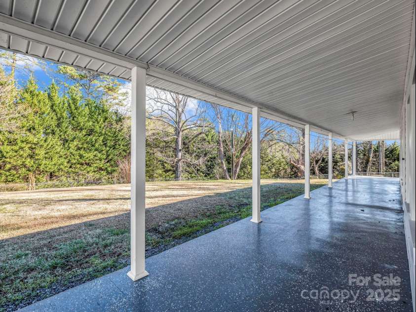 620 Smith Waldrop Road, Columbus, NC 28722.  MLS# CAR4209729, YatesRealty ID 15909. Wrap around porch at main house