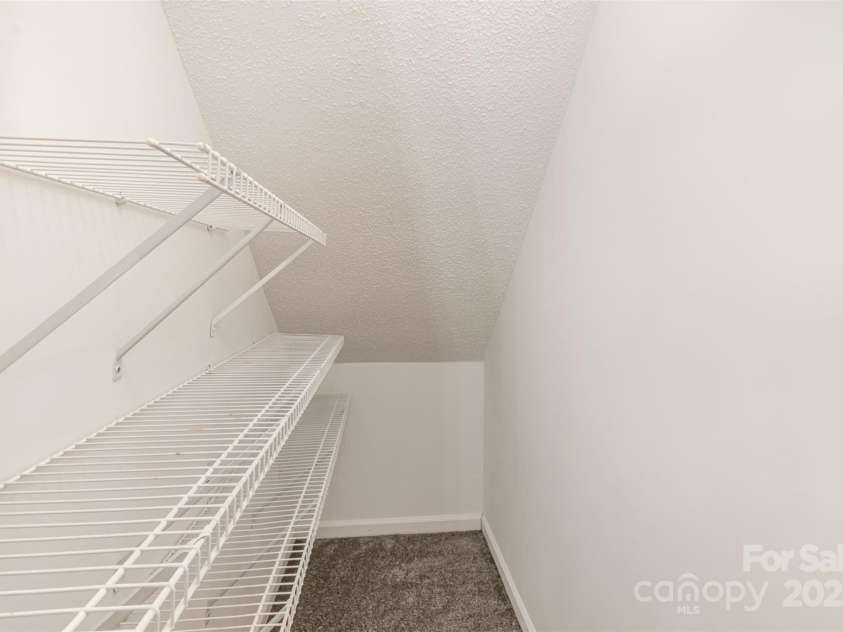 3610 Melrose Cottage Drive, Matthews, NC 28105.  MLS# CAR4223491, YatesRealty ID 1591. Under-stair storage