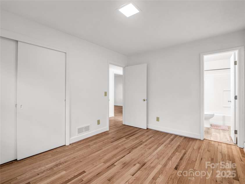 200 Little Wings Mountain Road, Columbus, NC 28722.  MLS# CAR4289310, YatesRealty ID 15911. Primary Bedroom with large closet and en-suite bath