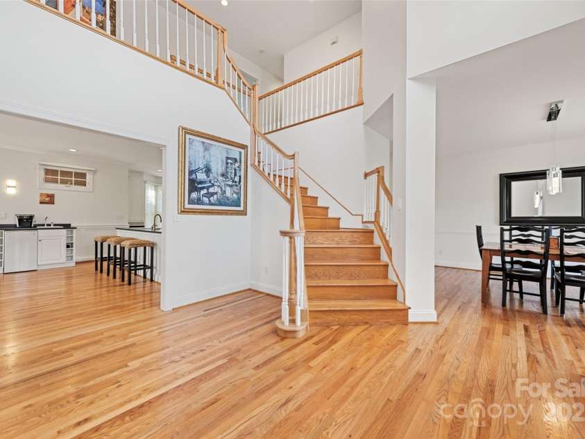 149 Southbrook Lane, Fletcher, NC 28732.  MLS# CAR4221393, YatesRealty ID 15918. Honey colored stained hardwoods create a warm welcome to family and friends. This grand two story foyer is light and bright.