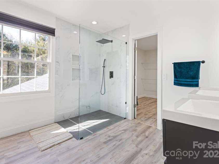 149 Southbrook Lane, Fletcher, NC 28732.  MLS# CAR4221393, YatesRealty ID 15918. Primary bath is sleek and freshly updated.
