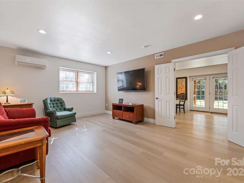 149 Southbrook Lane, Fletcher, NC 28732.  MLS# CAR4221393, YatesRealty ID 15918. THe finished basement is perfect for gathering to watch a game or enjoy movie night.