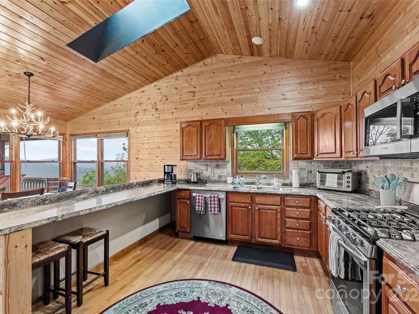 70 Moor Lane, Brevard, NC 28712.  MLS# CAR4134812, YatesRealty ID 1592. Enjoy the view as you cook and the skylight above