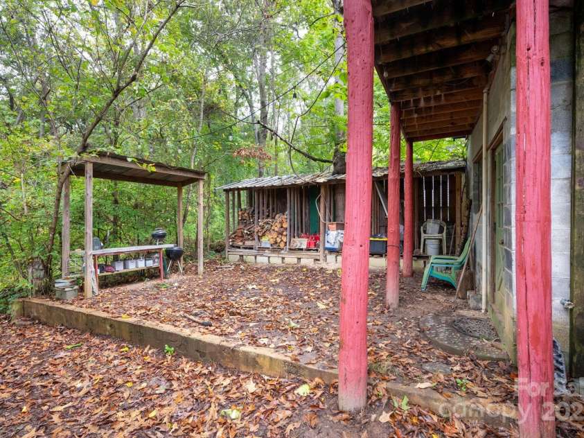 132 Little Knob Road, Asheville, NC 28803.  MLS# CAR4314463, YatesRealty ID 1593. Fire Ring and Firewood Storage Area