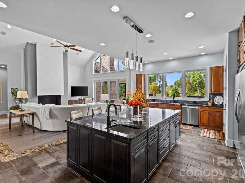 6032 Headlands Court, Belmont, NC 28012.  MLS# CAR4302643, YatesRealty ID 15936. Stunning chef's kitchen has cherry & maple cabinets, granite countertops, oversized kitchen island, dual built-in stainless steel Frigidaire refrigerator & freezer, stainless steel appliances, prep sink in kitchen islan