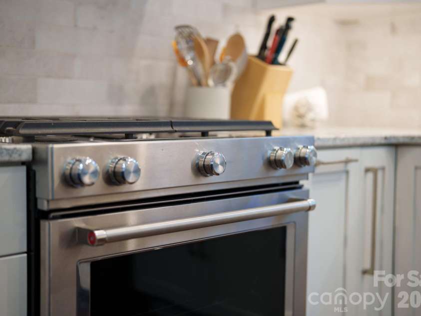 3302 Timber Trail, Asheville, NC 28804.  MLS# CAR4333678, YatesRealty ID 15948. Gas burning stove
