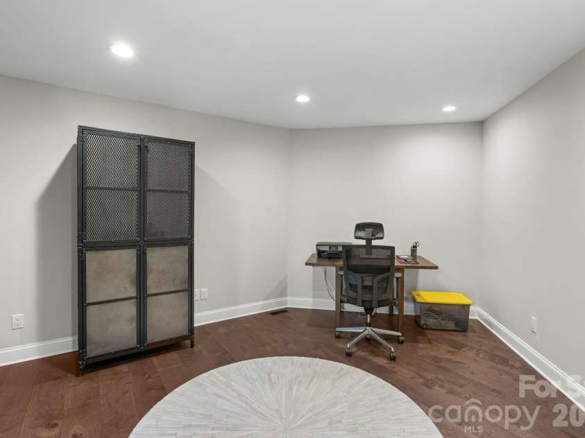 3302 Timber Trail, Asheville, NC 28804.  MLS# CAR4333678, YatesRealty ID 15948. Lower level office area or workout room