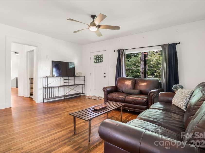 17 Springdale Avenue, Asheville, NC 28803.  MLS# CAR4261466, YatesRealty ID 15949. Bright living space with wood floors and natural light