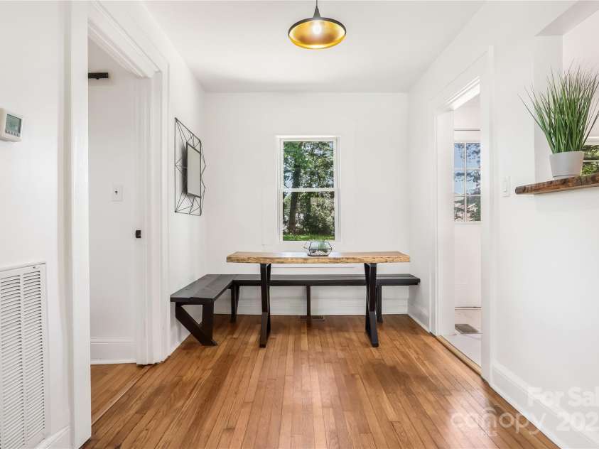 17 Springdale Avenue, Asheville, NC 28803.  MLS# CAR4261466, YatesRealty ID 15949. Open dining area connects living room and kitchen