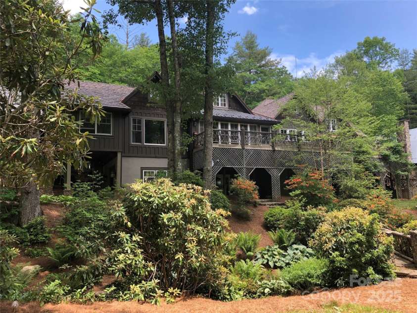 973 Sitting Rock Trail, Cullowhee, NC 28723.  MLS# CAR4257452, YatesRealty ID 15952. Rear View of Main Home with expansive Deck