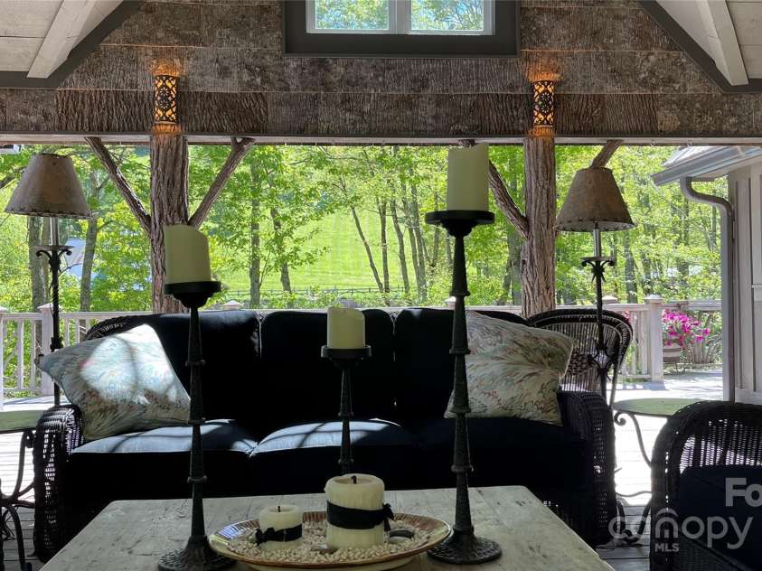 973 Sitting Rock Trail, Cullowhee, NC 28723.  MLS# CAR4257452, YatesRealty ID 15952. Soft Lighting, Cool Breezes & Great Views