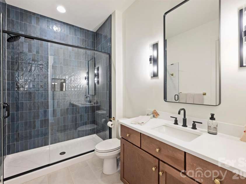 1521 Reflection Pointe Boulevard, Belmont, NC 28012.  MLS# CAR4346556, YatesRealty ID 15956. Basement Bathroom