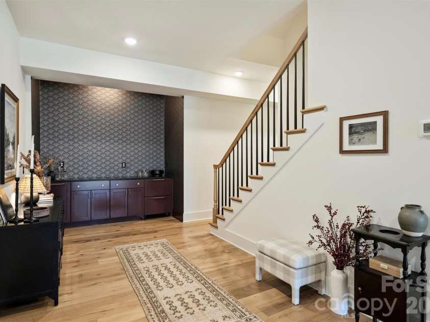 1521 Reflection Pointe Boulevard, Belmont, NC 28012.  MLS# CAR4346556, YatesRealty ID 15956. Built-in bar with mini fridge and ice maker - Basement