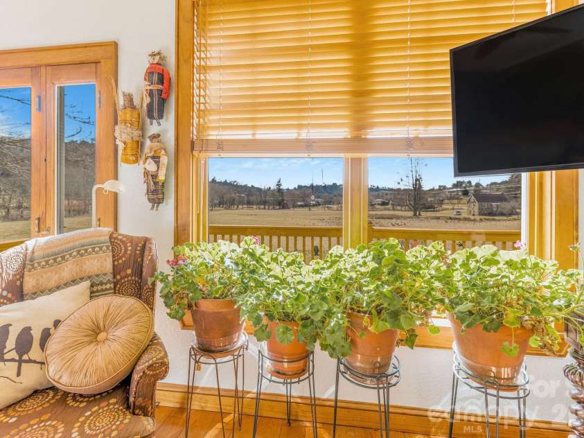 22 Mountain Spring Lane, Canton, NC 28716.  MLS# CAR4346093, YatesRealty ID 15957. Access to front deck from primary bedroom