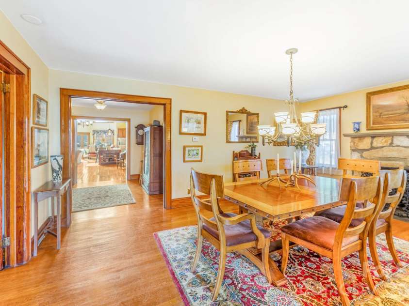 22 Mountain Spring Lane, Canton, NC 28716.  MLS# CAR4346093, YatesRealty ID 15957. Original stone cottage living room currently used as formal dining room.