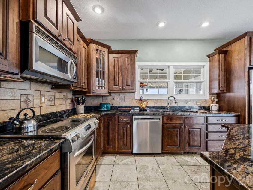 410 Lamp Post Drive, Zirconia, NC 28790.  MLS# CAR4345661, YatesRealty ID 15958. Kitchen with mountain view over sink