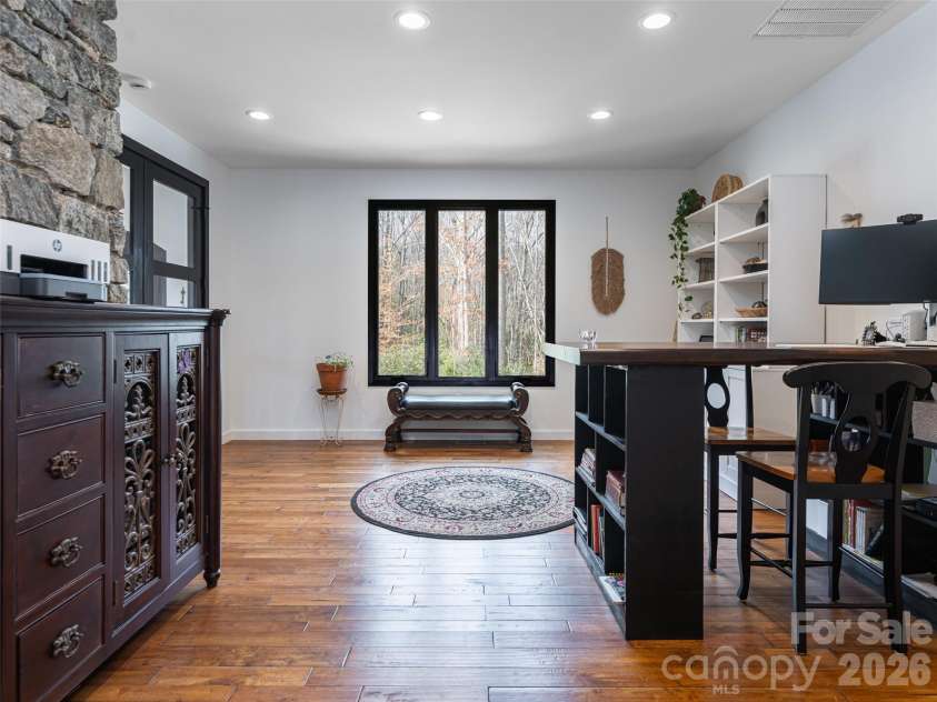 508 Avery Creek Road, Arden, NC 28704.  MLS# CAR4355626, YatesRealty ID 15960. Office off the Great Room featuring an interior stone wall