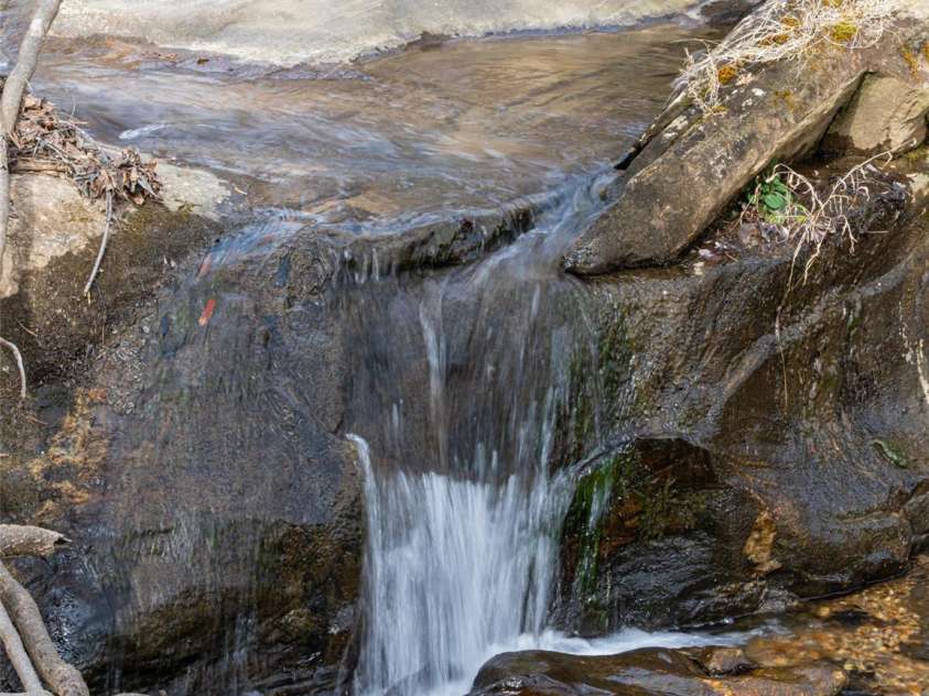 508 Avery Creek Road, Arden, NC 28704.  MLS# CAR4355626, YatesRealty ID 15960. Waterfall on the property
