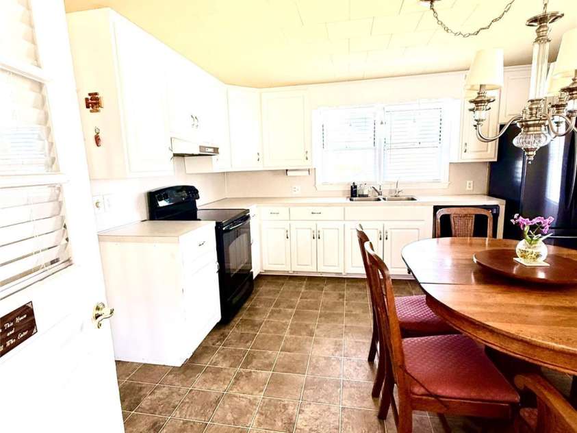 1005 Main Street, Oakboro, NC 28129.  MLS# CAR4357872, YatesRealty ID 15965. Entry to kitchen fromSunroom