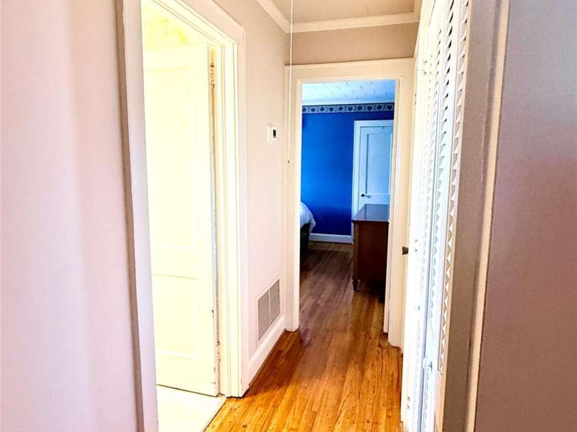1005 Main Street, Oakboro, NC 28129.  MLS# CAR4357872, YatesRealty ID 15965. Hallway between downstairs bedrooms