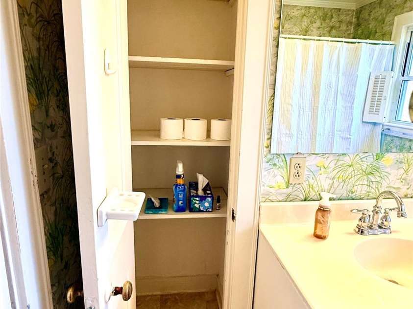 1005 Main Street, Oakboro, NC 28129.  MLS# CAR4357872, YatesRealty ID 15965. Linen closet in main bathroom