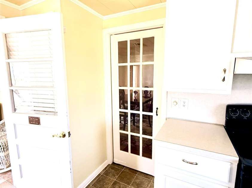 1005 Main Street, Oakboro, NC 28129.  MLS# CAR4357872, YatesRealty ID 15965. Swinging glass panel door to dining room