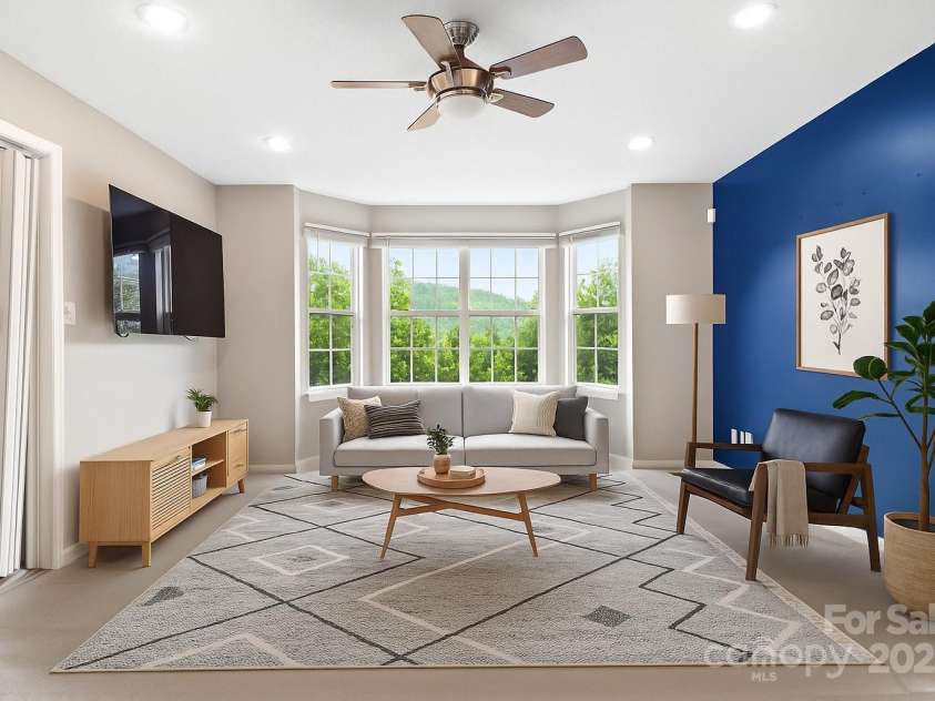 106 Thistle Tree Way, Weaverville, NC 28787.  MLS# CAR4248602, YatesRealty ID 15965. Virtually Staged - Living Room w/ Bay Window