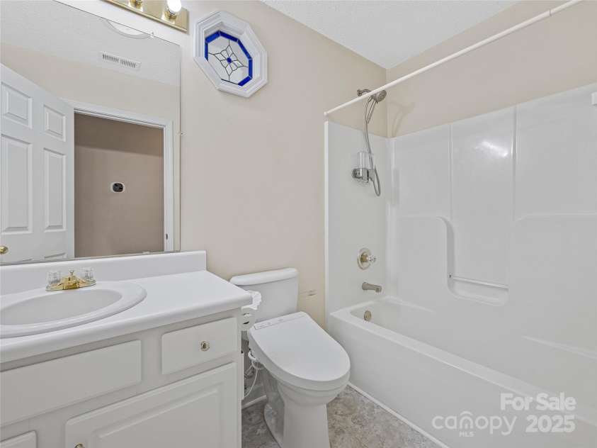 106 Thistle Tree Way, Weaverville, NC 28787.  MLS# CAR4315320, YatesRealty ID 15965. Hall Bathroom