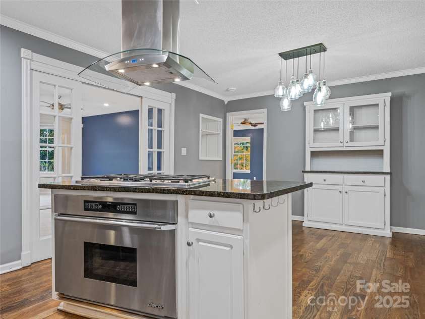 106 Thistle Tree Way, Weaverville, NC 28787.  MLS# CAR4315320, YatesRealty ID 15965. Kitchen opens to dining area and has screen porch access