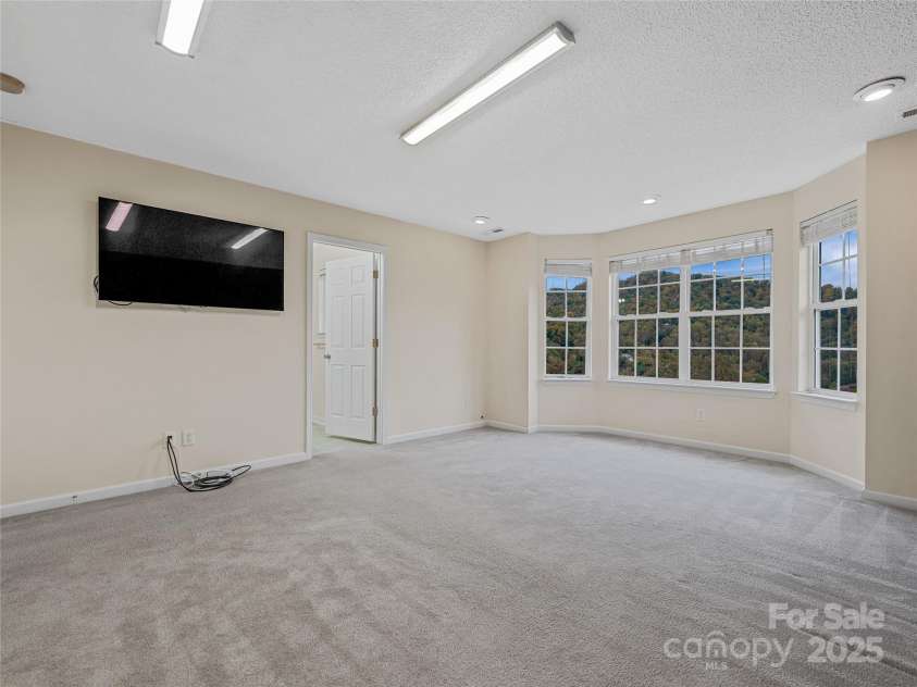 106 Thistle Tree Way, Weaverville, NC 28787.  MLS# CAR4315320, YatesRealty ID 15965. TV is wall mounted and included